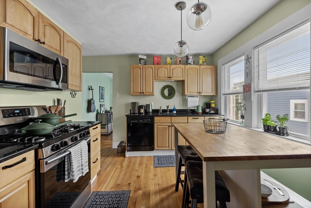 63-65 Brookley Road, Unit 3 Boston, MA 02130 - Photo 14 of 31 a kitchen with a stove and a sink