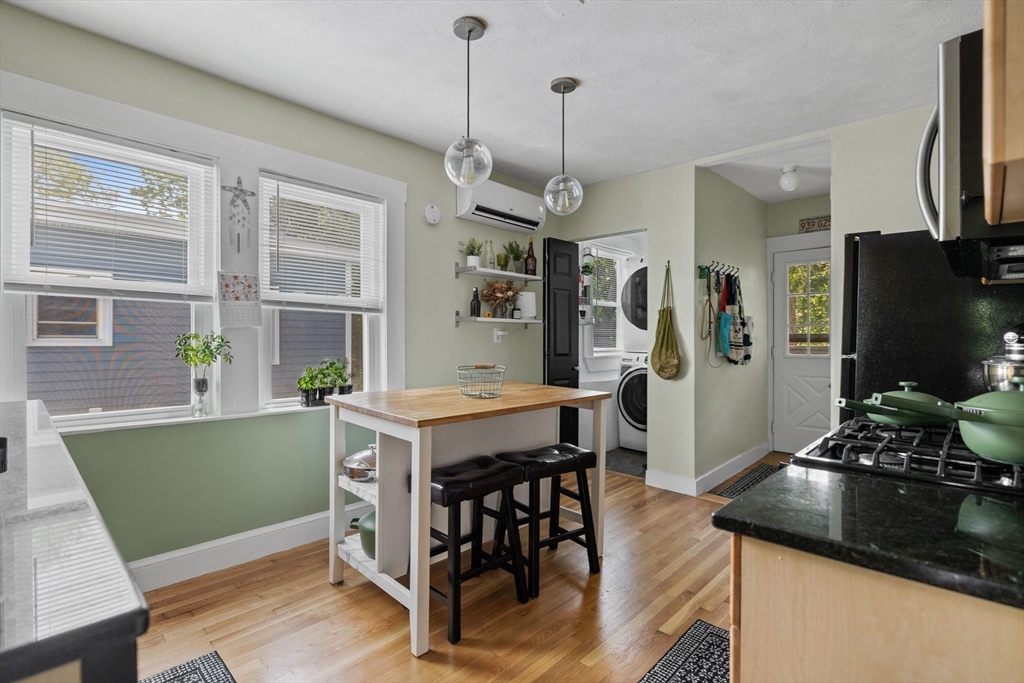 63-65 Brookley Road, Unit 3 Boston, MA 02130 - Photo 15 of 31 a kitchen with a table and chairs in it