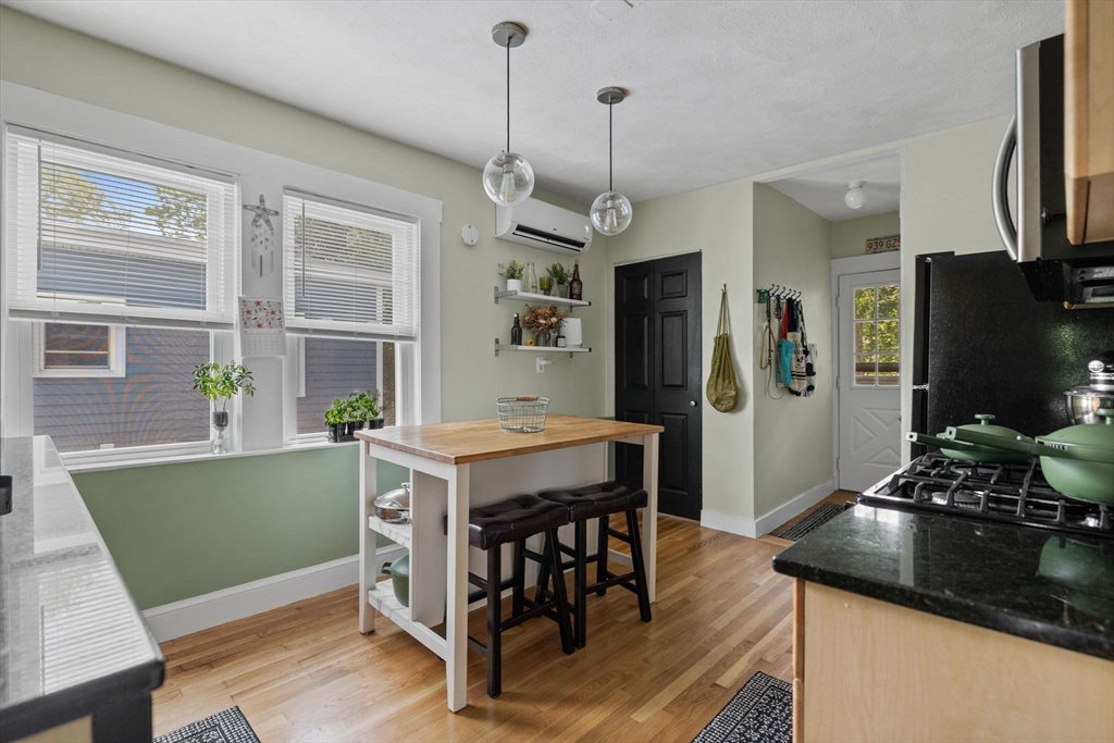 63-65 Brookley Road, Unit 3 Boston, MA 02130 - Photo 16 of 31 a kitchen with a table and chairs in it