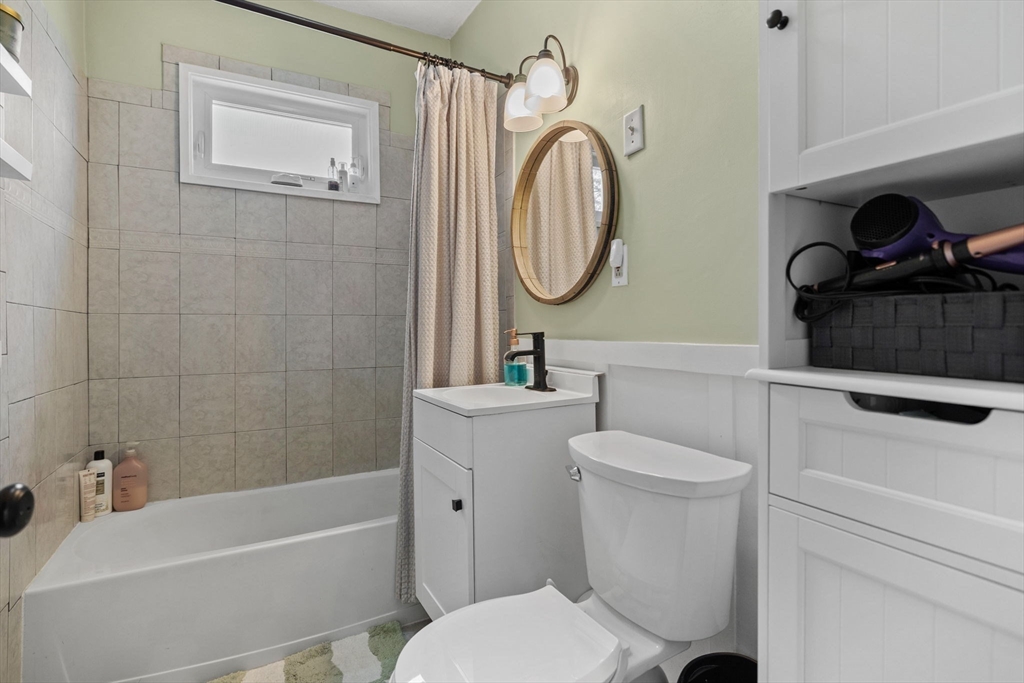 63-65 Brookley Road, Unit 3 Boston, MA 02130 - Photo 19 of 31 a bathroom with a toilet a sink and a bathtub