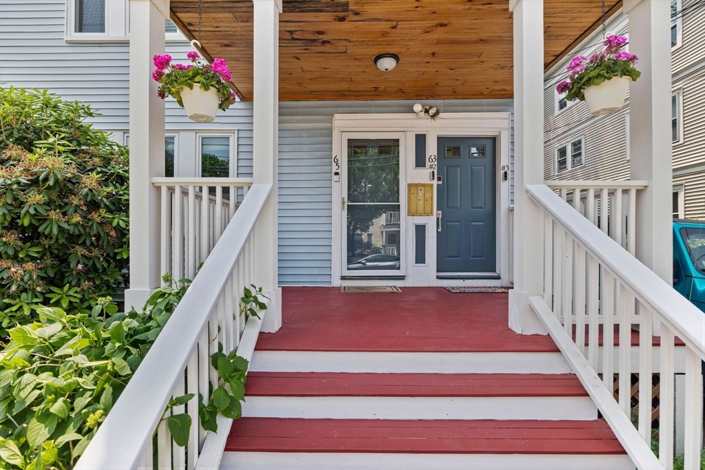63-65 Brookley Road, Unit 3 Boston, MA 02130 - Photo 2 of 31 a view of a house with wooden stairs