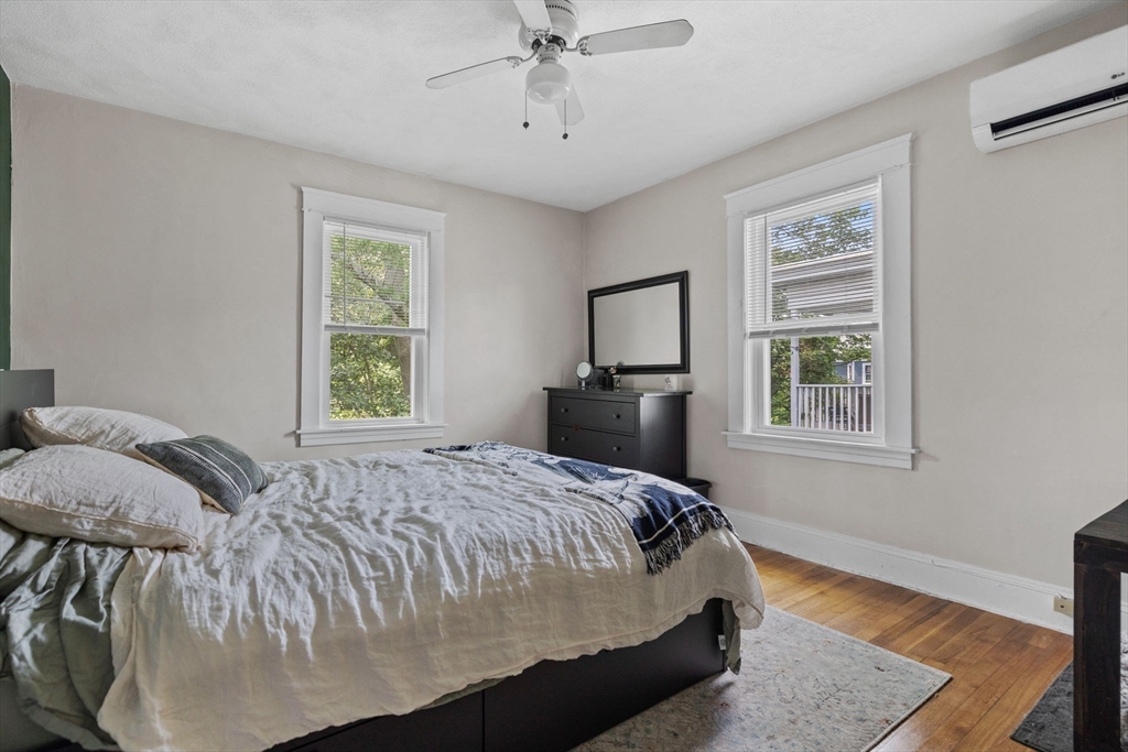 63-65 Brookley Road, Unit 3 Boston, MA 02130 - Photo 23 of 31 a bed sitting in a bedroom next to a window