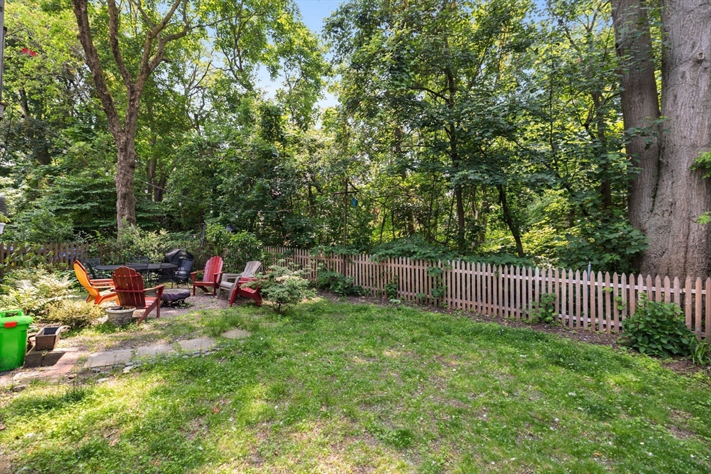 63-65 Brookley Road, Unit 3 Boston, MA 02130 - Photo 26 of 31 a view of a backyard with a garden and entertaining space