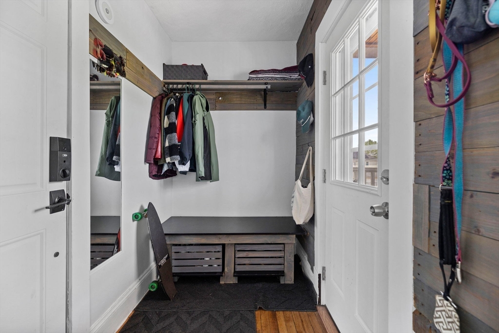 63-65 Brookley Road, Unit 3 Boston, MA 02130 - Photo 3 of 31 a view of walk in closet with clothes and shoes