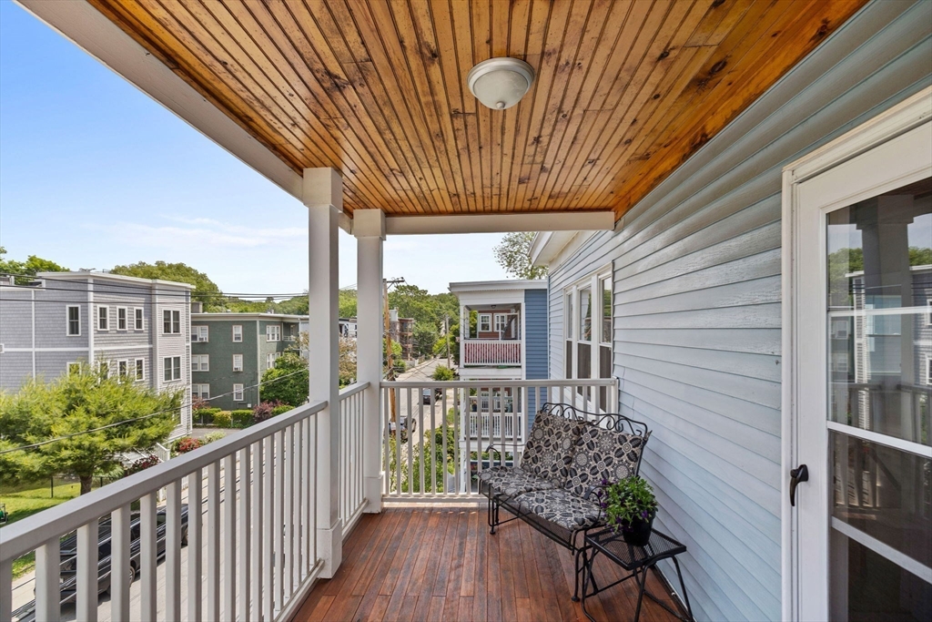 63-65 Brookley Road, Unit 3 Boston, MA 02130 - Photo 5 of 31 a porch with seating space