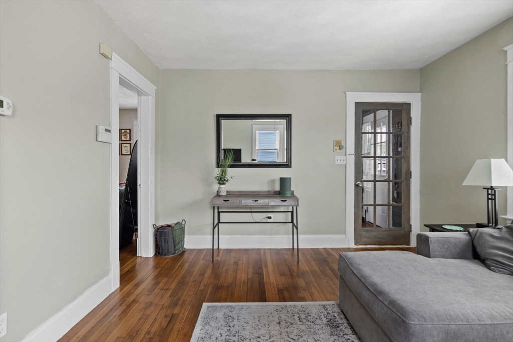 63-65 Brookley Road, Unit 3 Boston, MA 02130 - Photo 6 of 31 a bedroom with furniture and wooden floor