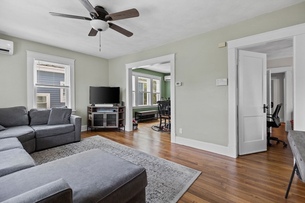 63-65 Brookley Road, Unit 3 Boston, MA 02130 - Photo 9 of 31 a living room with furniture and a flat screen tv