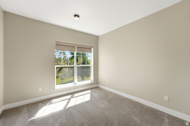 900 Bitner Road, Unit P17 Park City, UT 84098 - Photo 25 of 45 Room featuring light neutral wall paint, gray carpet, a single window with blinds, white baseboards, and a flush-mount ceiling light fixture