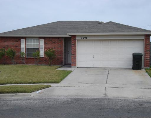 7605 Wolverine Drive Corpus Christi, TX 78414 - Photo 2 of 10 a front view of a house with a yard and garage