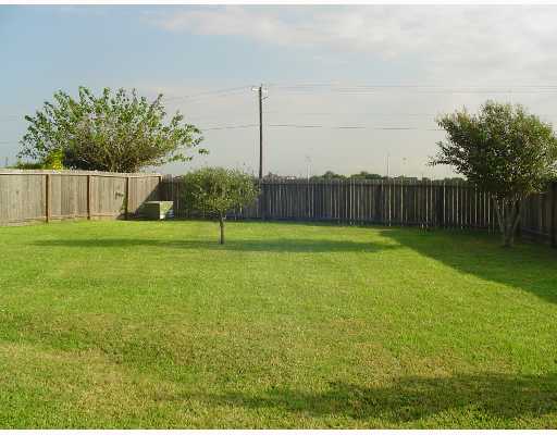 7605 Wolverine Drive Corpus Christi, TX 78414 - Photo 9 of 10 a view of a yard with a fence