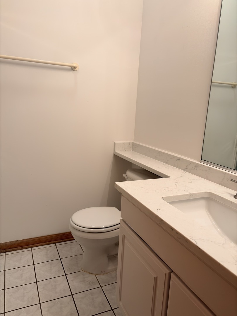 4101 North Kenmore Avenue, Unit 2S Chicago, IL 60613 - Photo 11 of 11 a bathroom with a sink and toilet