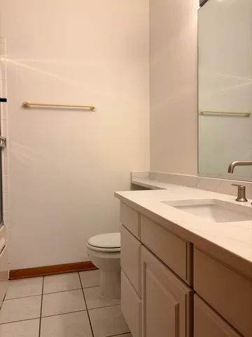 a bathroom with a sink and toilet
