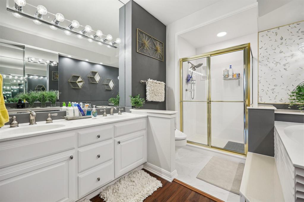 5200 Keller Springs Road, Unit 815 Dallas, TX 75248 - Photo 13 of 35 a bathroom with a double vanity sink and mirror