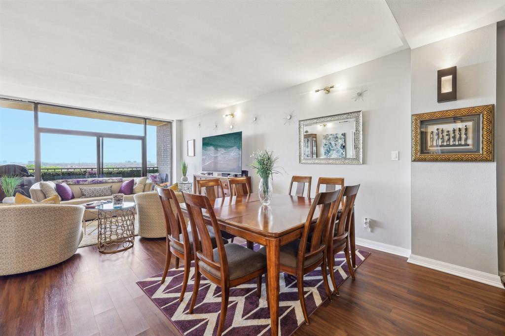5200 Keller Springs Road, Unit 815 Dallas, TX 75248 - Photo 2 of 35 a view of a dining room with furniture and wooden floor