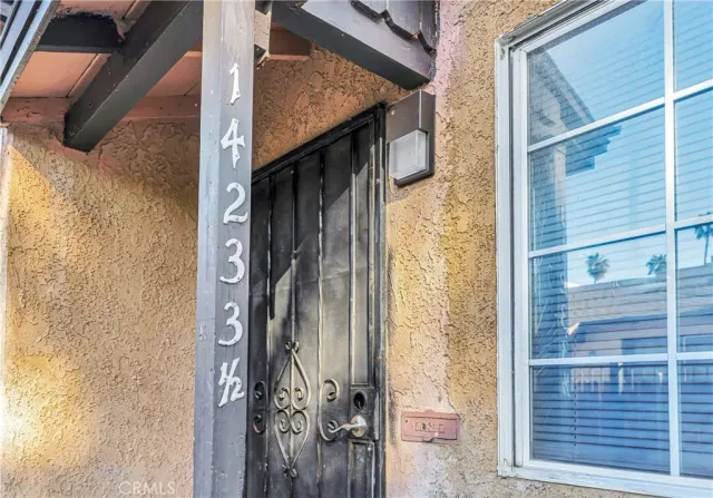 a yellow house with a outdoor space