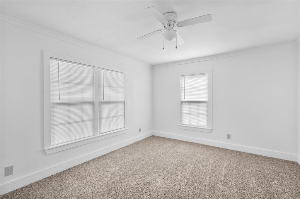 903 Lynn Street Bonham, TX 75418 - Photo 16 of 29 an empty room with a empty space and windows