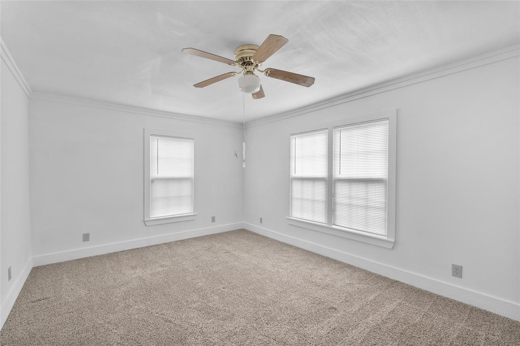 903 Lynn Street Bonham, TX 75418 - Photo 18 of 29 an empty room with windows and fan