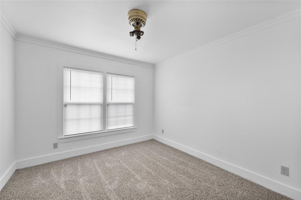 903 Lynn Street Bonham, TX 75418 - Photo 20 of 29 an empty room with a window