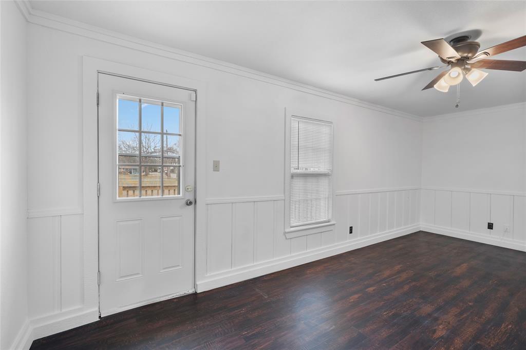 903 Lynn Street Bonham, TX 75418 - Photo 21 of 29 an empty room with wooden floor and windows