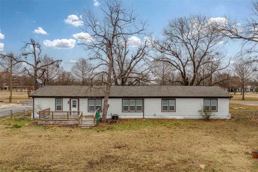 903 Lynn Street Bonham, TX 75418 - Photo 26 of 29 a front view of a house with garden