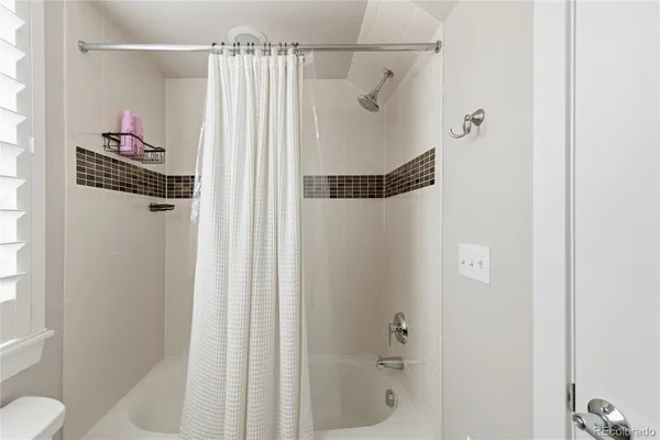 a bathroom with a shower and a toilet