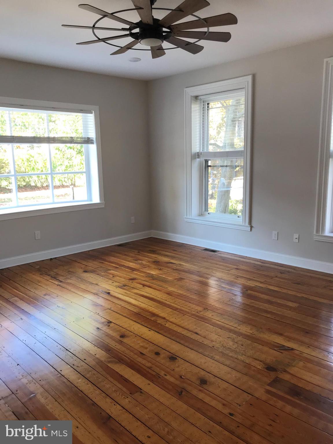 15 A Potter Street Haddonfield, NJ 08033 - Photo 5 of 11 an empty room with wooden floor and windows