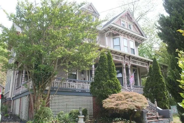 front view of a house with a tree
