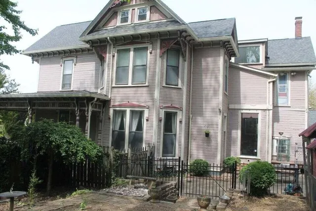 a group of people standing in a big yard