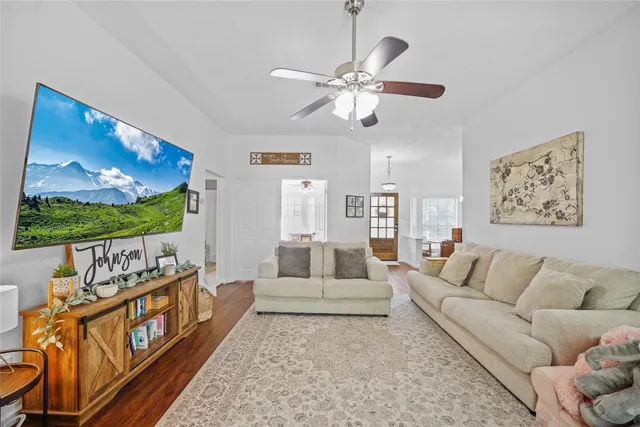 a living room with furniture and a flat screen tv