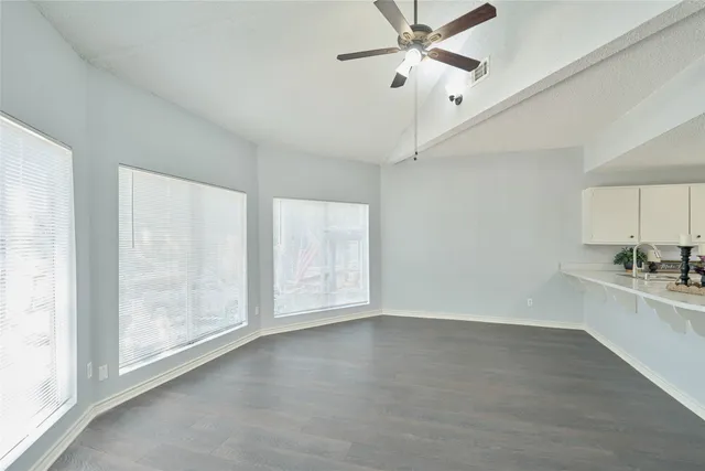 a view of a kitchen with a sink and a window