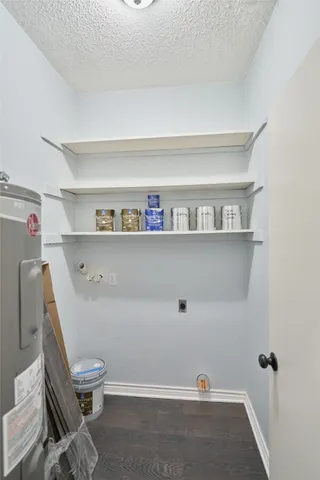 a room with a chair and white walls