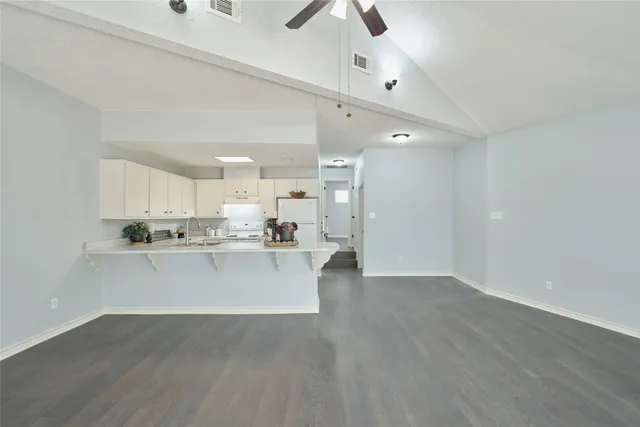 a view of kitchen with wooden floor