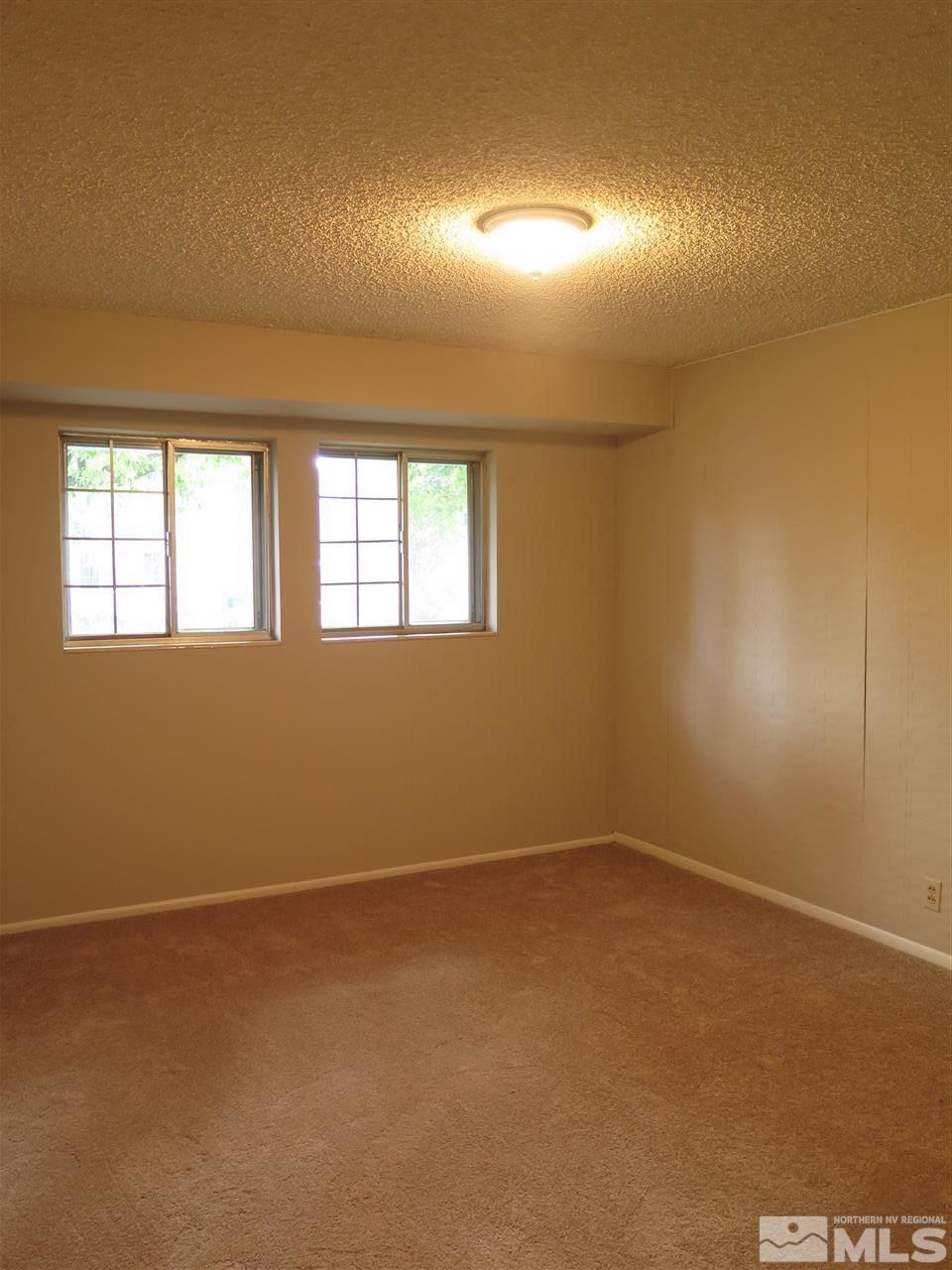 1825 Hawthorne Road Reno, NV 89502 - Photo 13 of 21 an empty room with windows
