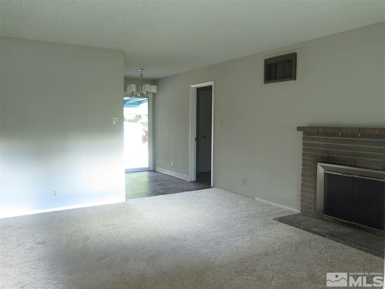 1825 Hawthorne Road Reno, NV 89502 - Photo 3 of 21 a view of empty room with a fireplace