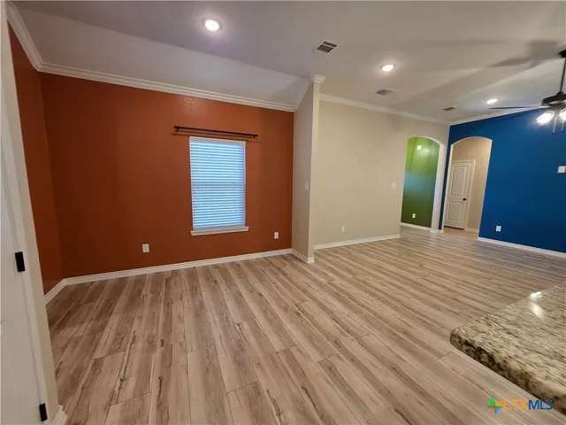 a view of a livingroom with wooden floor