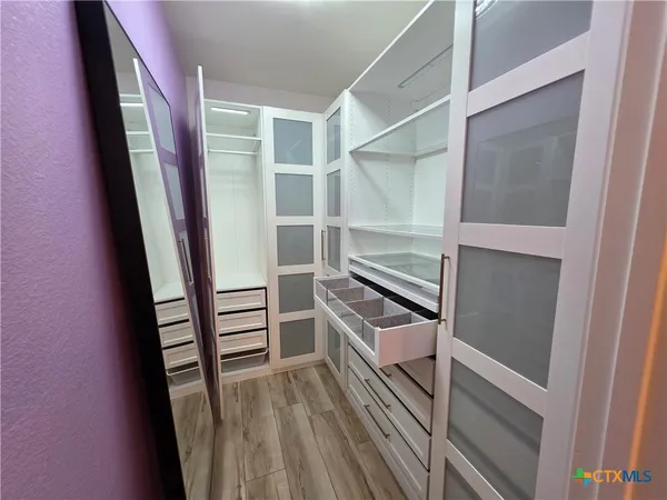 a view of an empty walk in closet