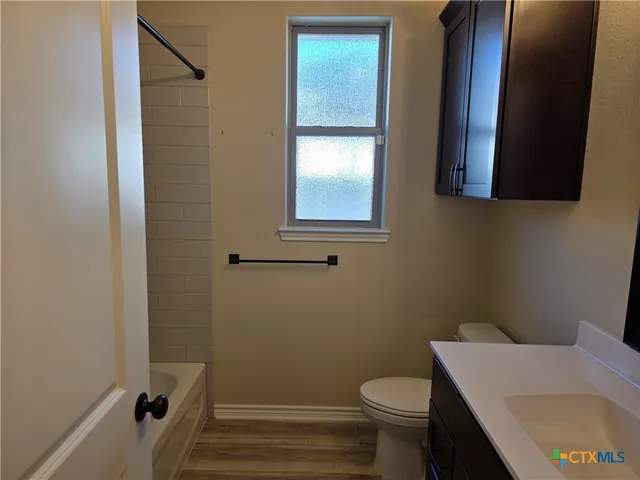 a bathroom with a sink and toilet
