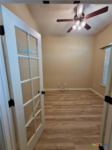 a view of an empty room with a window