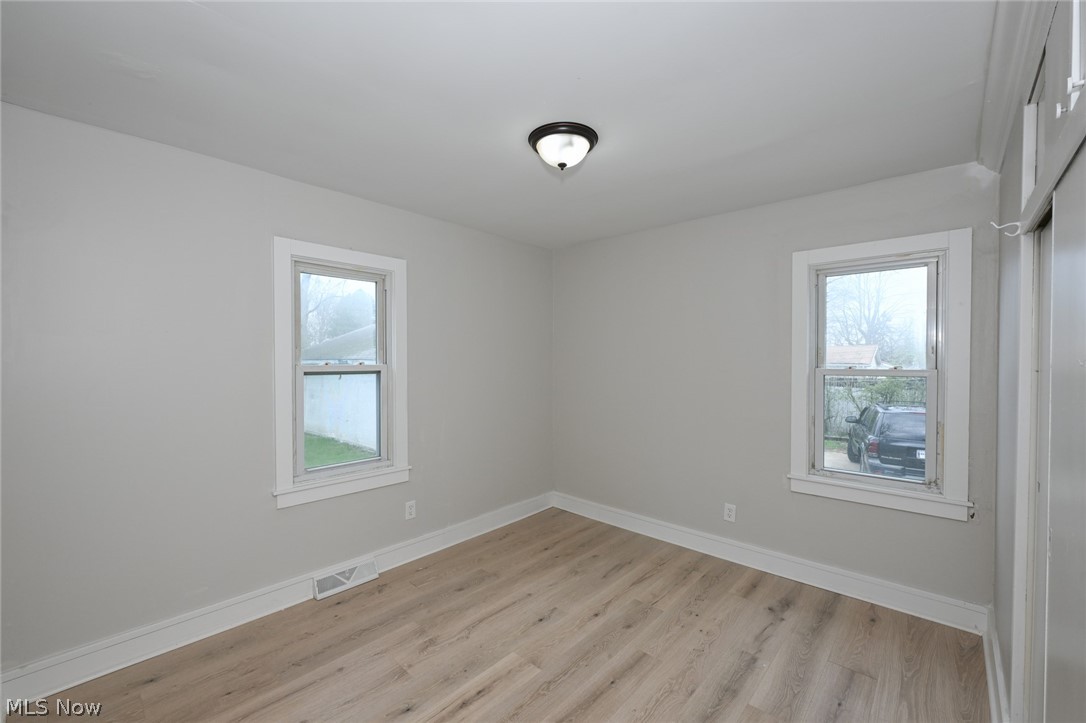 1520 Sheffield Road Cleveland, OH 44121 - Photo 25 of 36 Unfurnished room featuring light hardwood / wood-style flooring