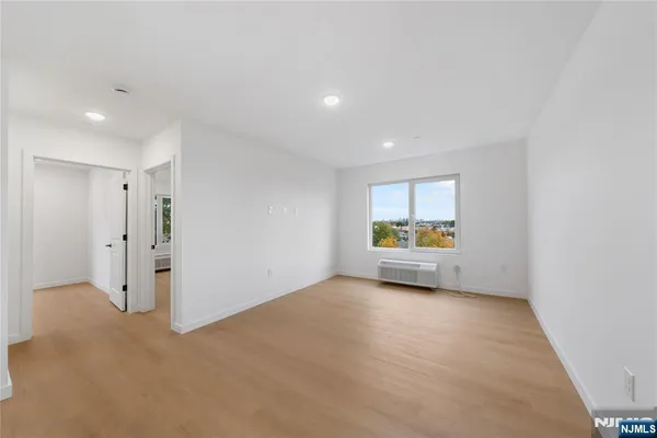 a view of an empty room with a window