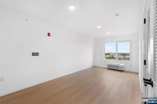 a view of an empty room with a window