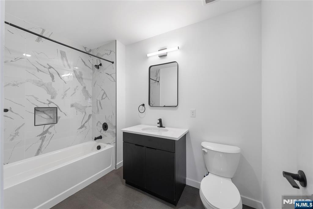 768 Bergen Street, Unit 3G Newark, NJ 07108 - Photo 6 of 15 a bathroom with a sink toilet and shower