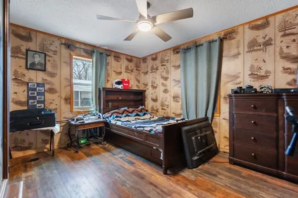 a bed room with furniture and book shelf