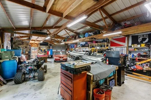 a view of parking area with large trees