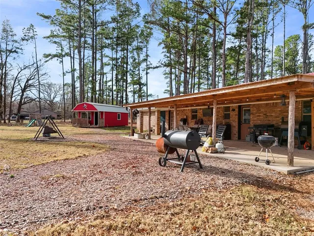 a patio with table and chairs