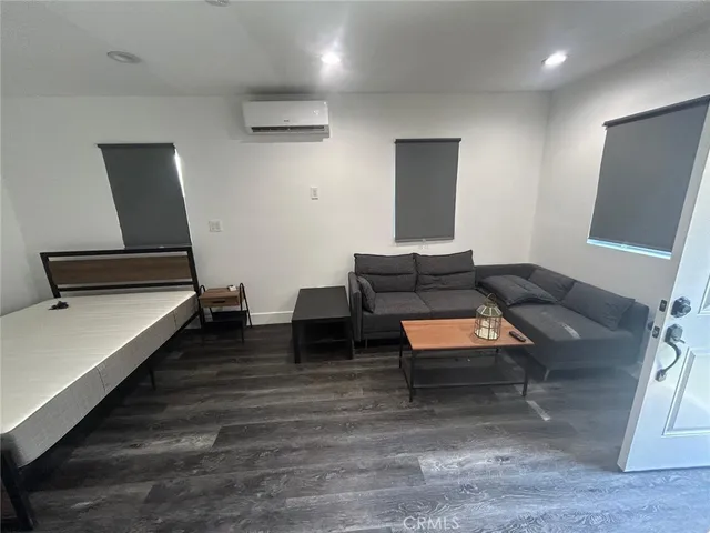 a living room with furniture and a rug