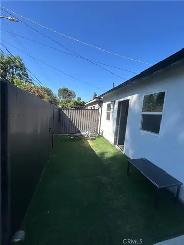 a view of backyard with seating space