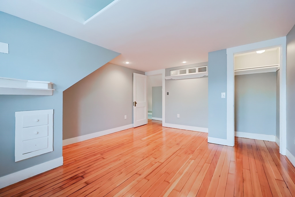 27-29 Brookvale Street Boston, MA 02124 - Photo 30 of 42 a view of an empty room with wooden floor
