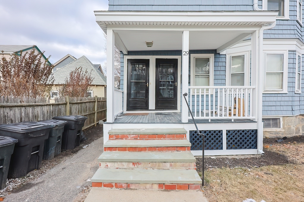 27-29 Brookvale Street Boston, MA 02124 - Photo 3 of 42 a front view of a house with a porch