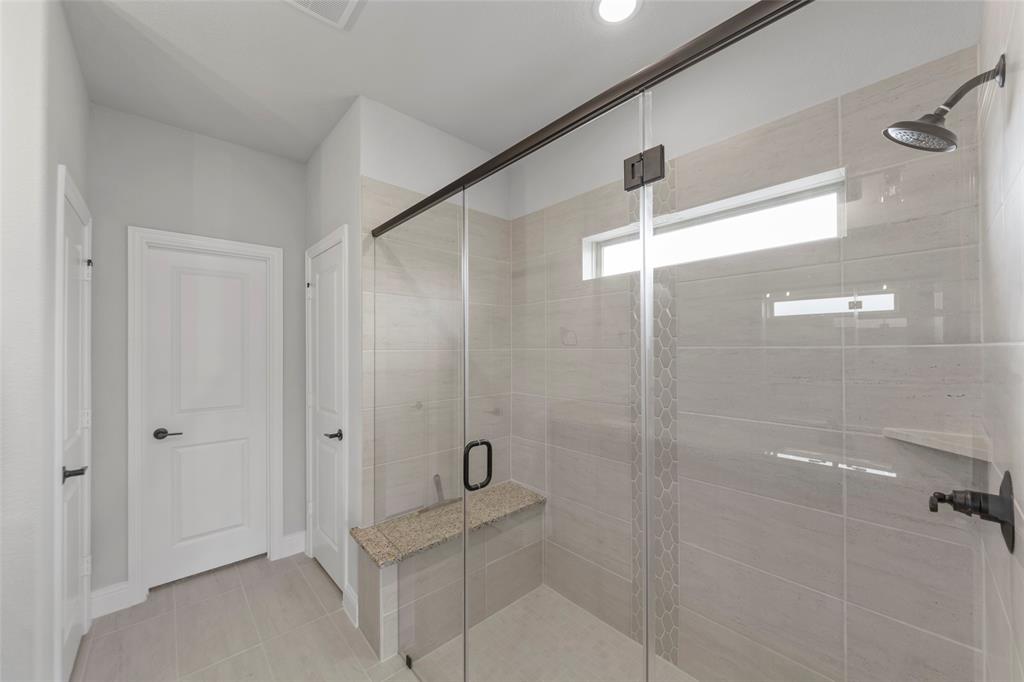 3405 Heathrow Road Mesquite, TX 75181 - Photo 14 of 30 a bathroom with a shower and a toilet